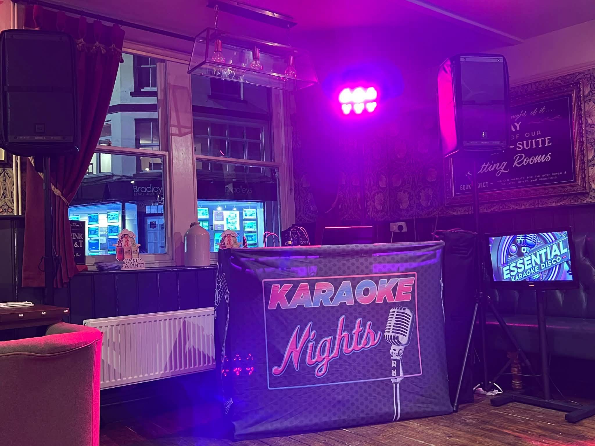 Karaoke Nights booth, speakers and an Essential Karaoke Disco screen.